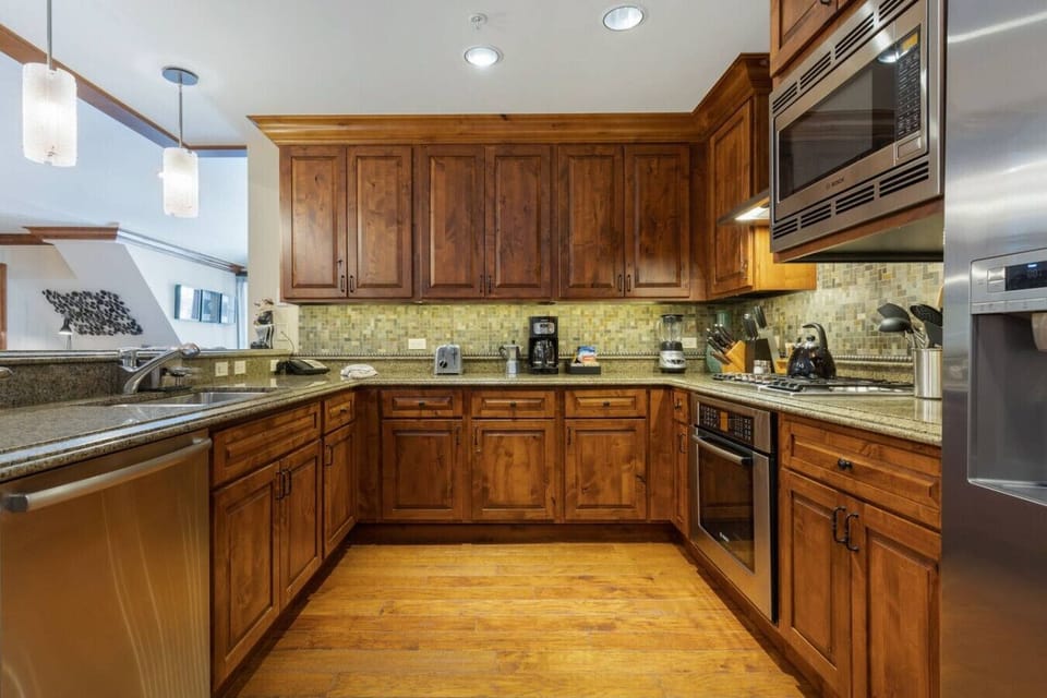 Fully Stocked Kitchen with Bar Seating