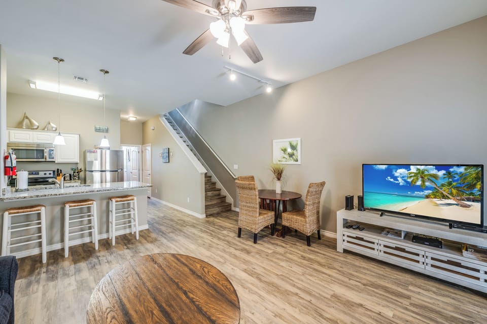 Your spacious open-concept haven combines modern coastal style with cozy comfort, featuring a fully-equipped kitchen flowing into inviting living spaces.