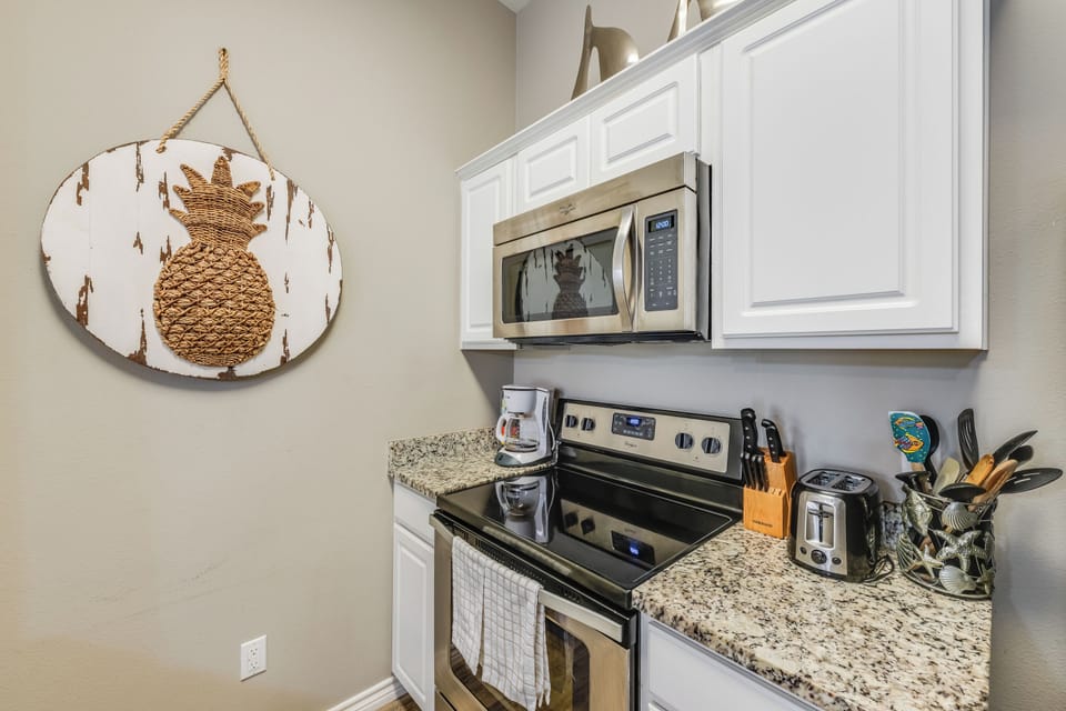 Your fully equipped kitchen makes meal prep a breeze with granite countertops, modern appliances, and thoughtful tropical touches that make you feel instantly at home.