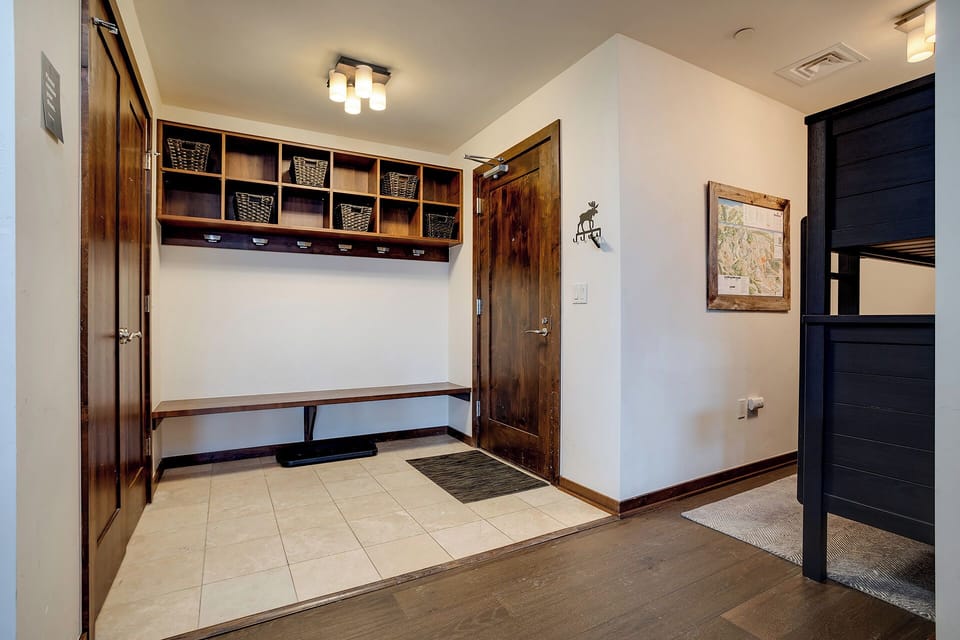 Your mudroom welcomes you with organized storage cubbies and a built-in bench, perfect for stashing gear after mountain adventures.