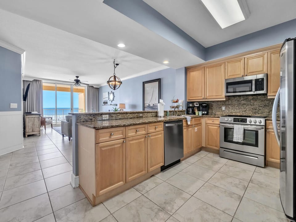 Your spacious kitchen features granite countertops, stainless steel appliances, and an open design that flows beautifully into the living area.