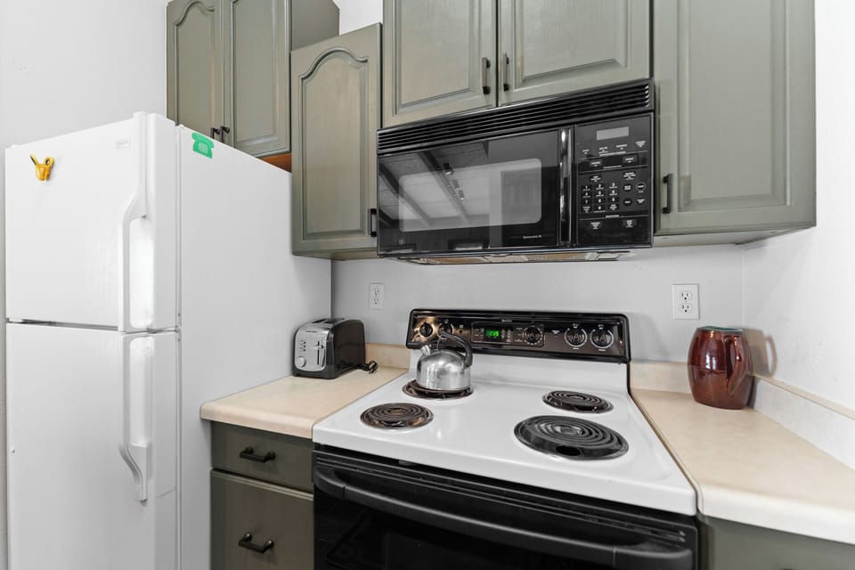 Your fully equipped kitchen features everything you need for home cooking, from the microwave and stove to ample storage space.