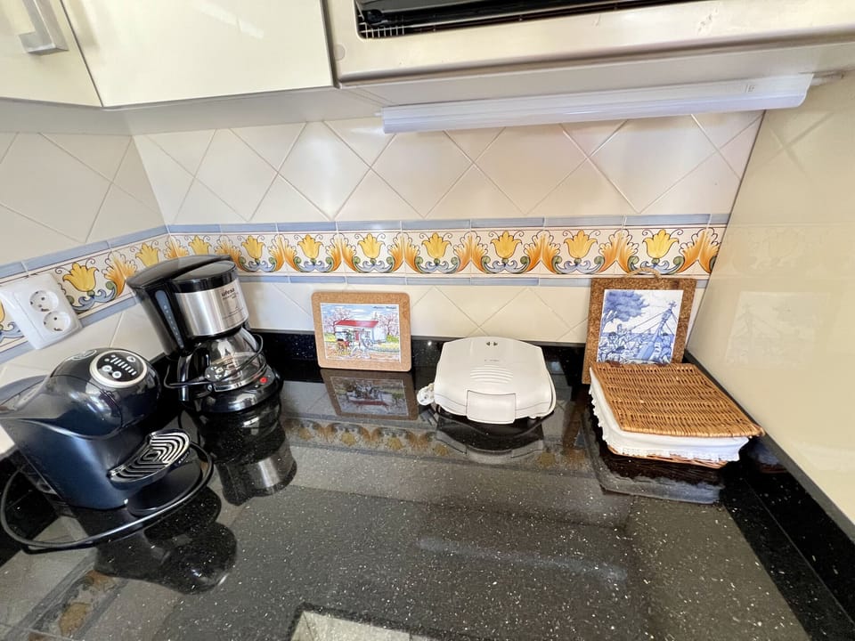 Coffee/tea maker, microwave, dishwasher, cookware/dishes/utensils