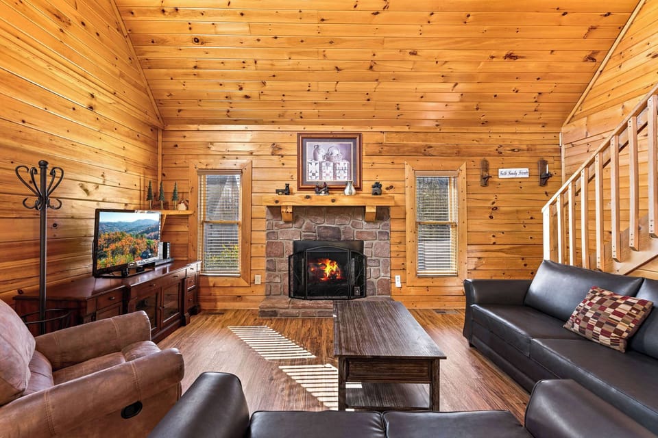Cozy living space with leather seating, Smart TV, and gas fireplace 