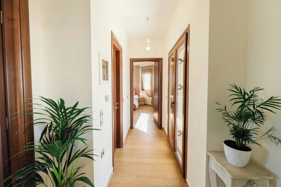 Chic Corridor: Modern, spacious corridors leading to the villa's beautifully designed rooms.
