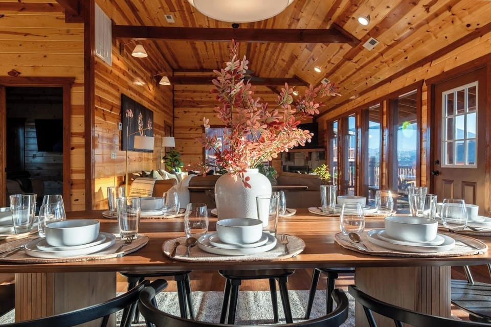 The dining table (seats 8) is part of the open floor plan next to the kitchen and dining room on the main level