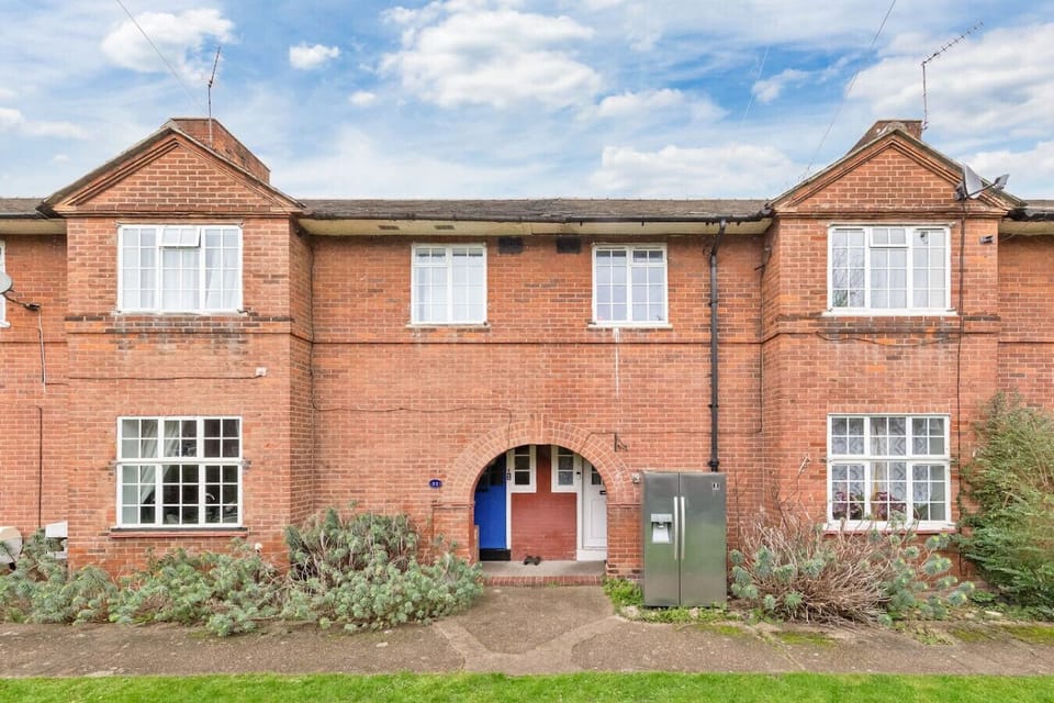 The exterior of the property boasts charming period features, blending traditional architecture with modern touches.