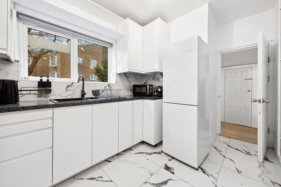 A well-equipped, modern kitchen with sleek countertops and all the appliances you need to prepare your meals. It`s spacious and functional, making cooking a breeze.
