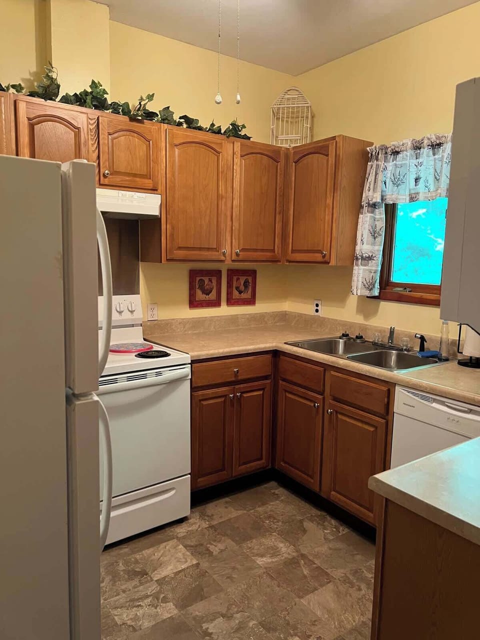 The kitchen is fully stocked with basic cooking essentials.