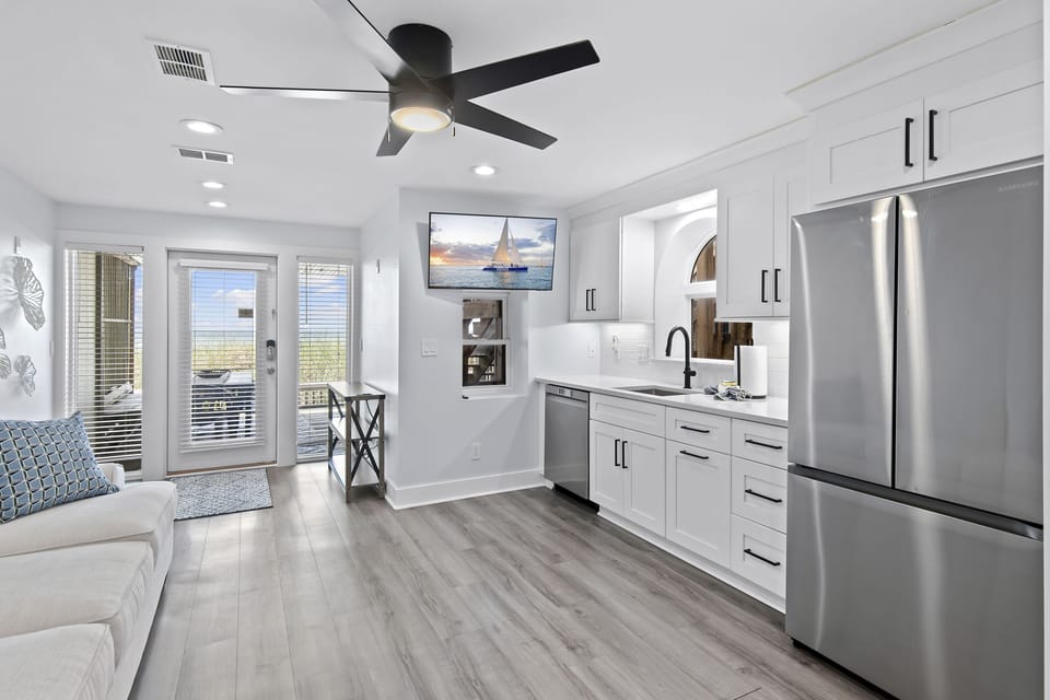 The 1st Floor features another Living Room w/ 50" Smart TV, Pre-loaded Game Console, a Kitchenette, and Patio Access - Great for the Kids!