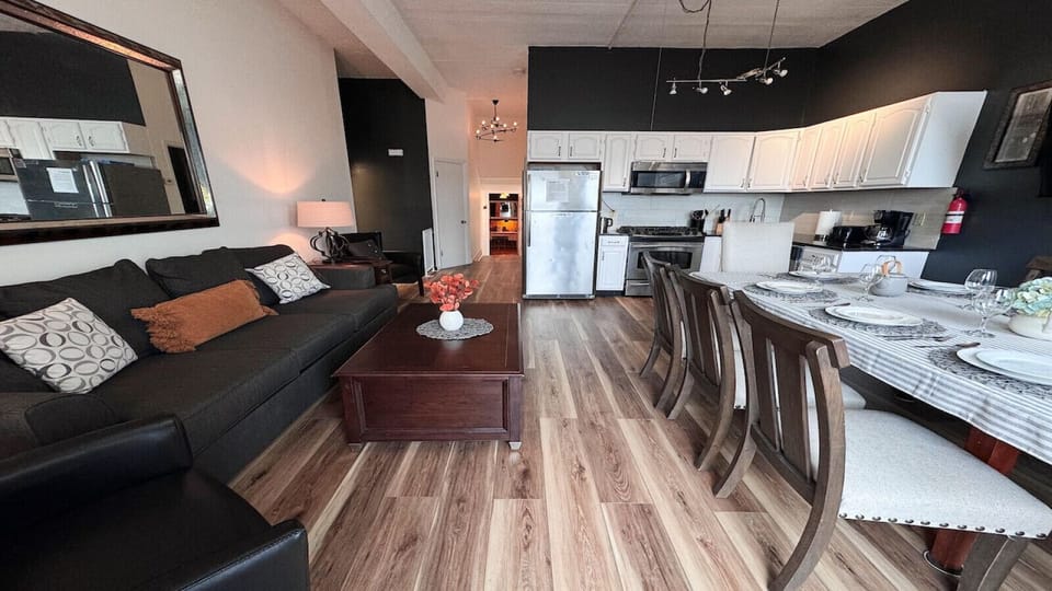 Living room, apartment # 1, queen, pullout sofa , ceiling, fan, TV, window, AC, large dining table