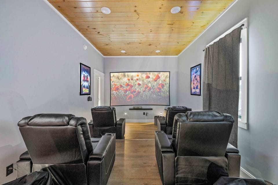 Enjoy a massive 120-inch projector screen paired with a sound bar and full surround sound system for a true cinematic experience right at home.