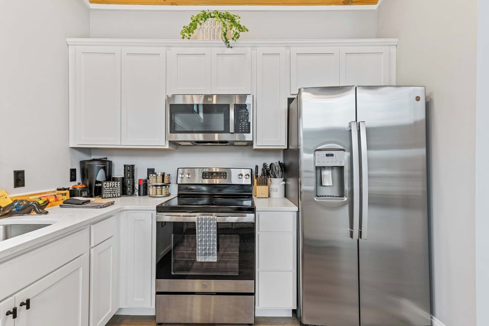 Step into a bright, roomy kitchen designed for comfort, featuring generous counter space and an open layout that makes cooking and entertaining easy.