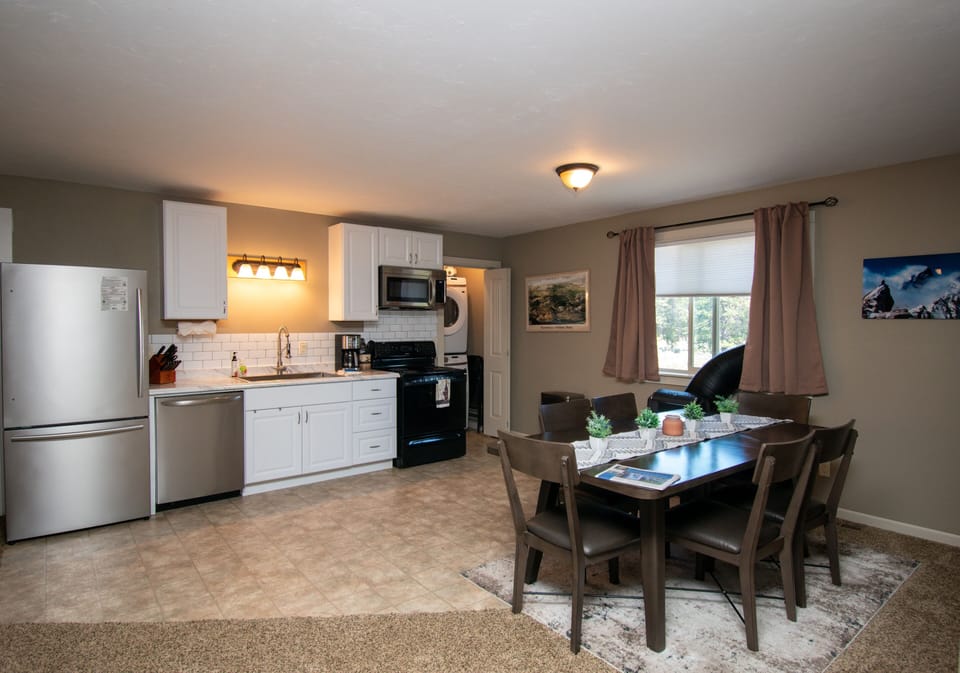 “Apartment” kitchen with laundry units on second floor 