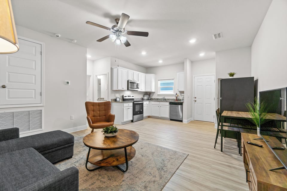 Your open-concept living space combines comfort and style with a fully equipped kitchen, cozy seating, and modern finishes for relaxing stays.