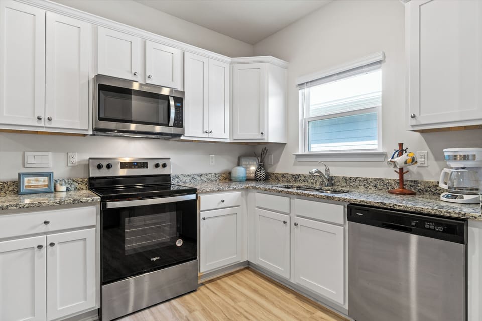 Your fully-equipped kitchen awaits with granite countertops, stainless appliances, and everything you need to create memorable meals during your stay.