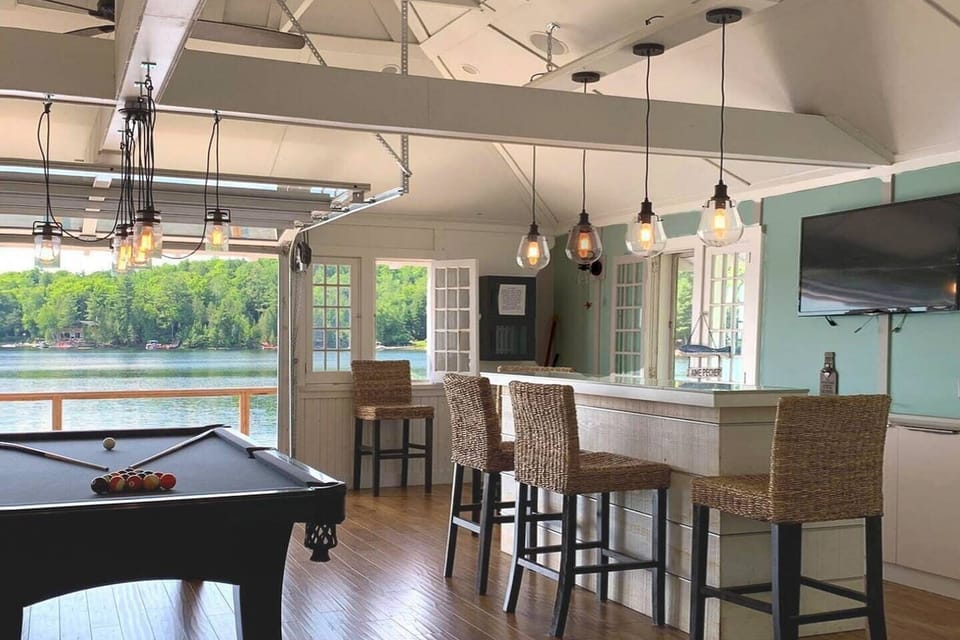 Summertime at the Boathouse Lounge; the door to the balcony is letting in the sunshine and the view