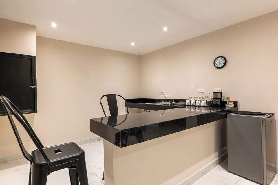 Two Bedroom Deluxe Suite | Private kitchen | Coffee/tea maker, mini-fridge, stovetop, cookware/dishes/utensils