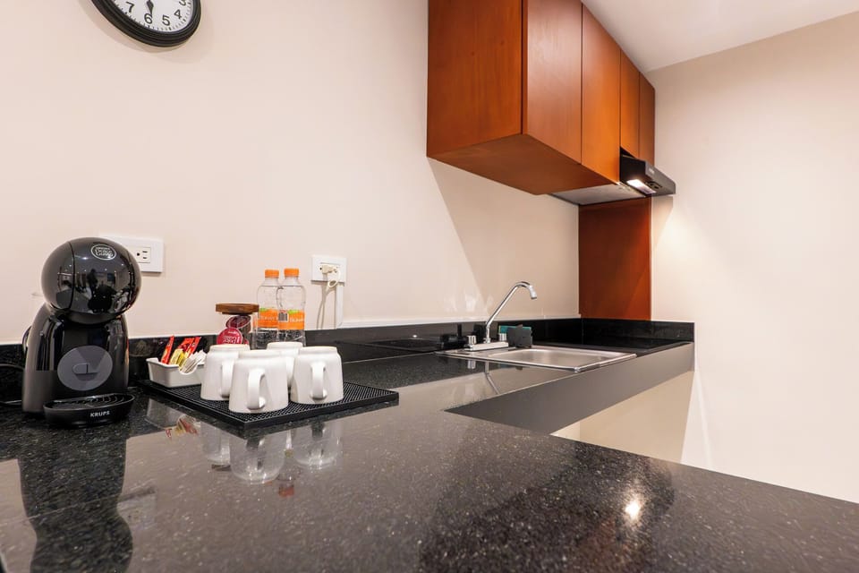 Two Bedroom Junior Suite | Private kitchen | Coffee/tea maker, mini-fridge, stovetop, cookware/dishes/utensils