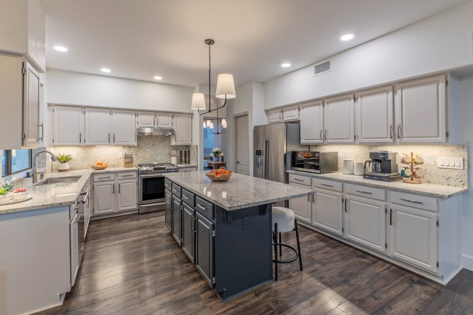 Modern and well equipped kitchen has both Keurig and drip coffee makers.