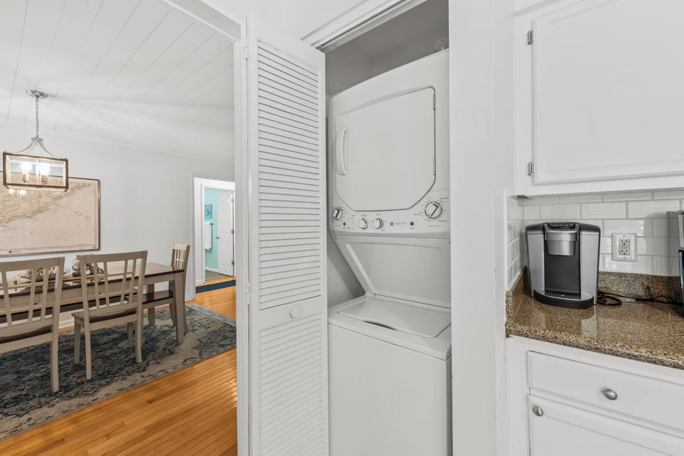 A convenient washer & dryer is located in the kitchen area.