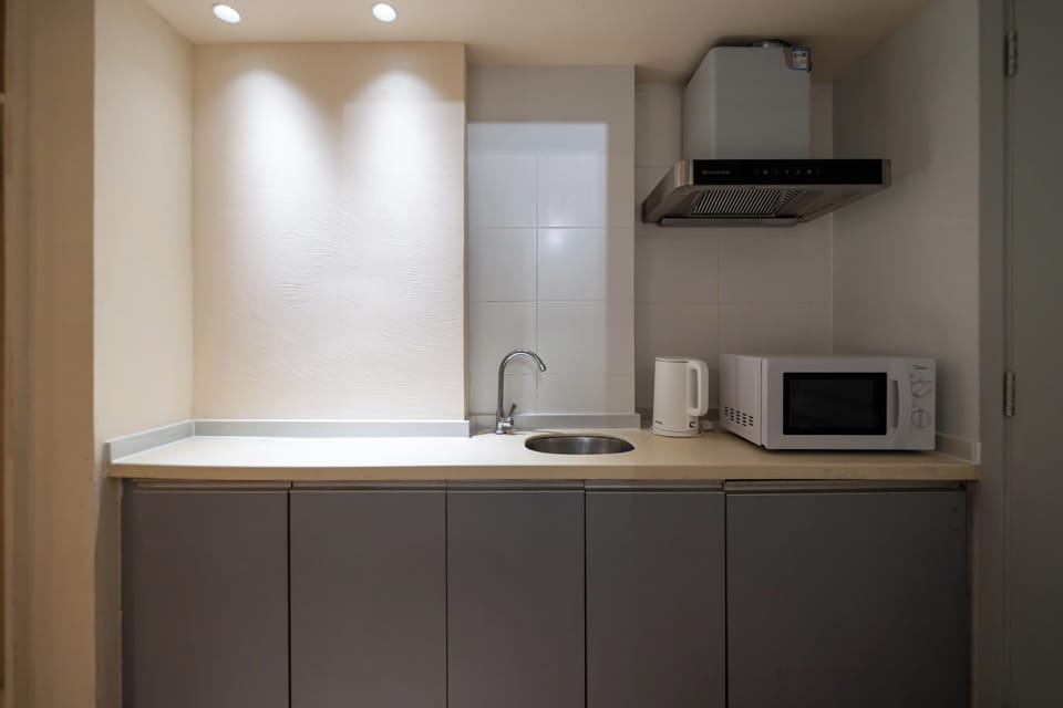 Double Room, City View | Private kitchen | Fridge