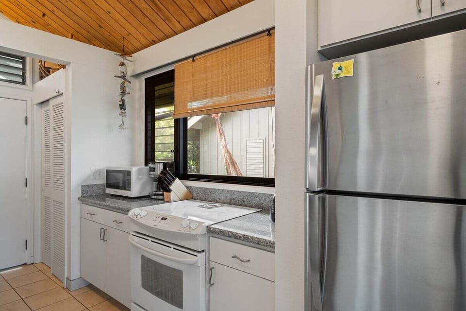 Stainless steel refrigerator with upper freezer that provides plenty of cold storage for your stay.