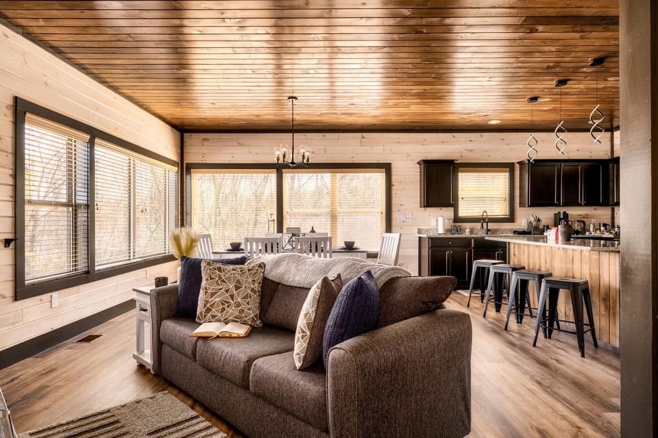 An open layout plan creating a large, inviting space as well as allowing natural light in the room.