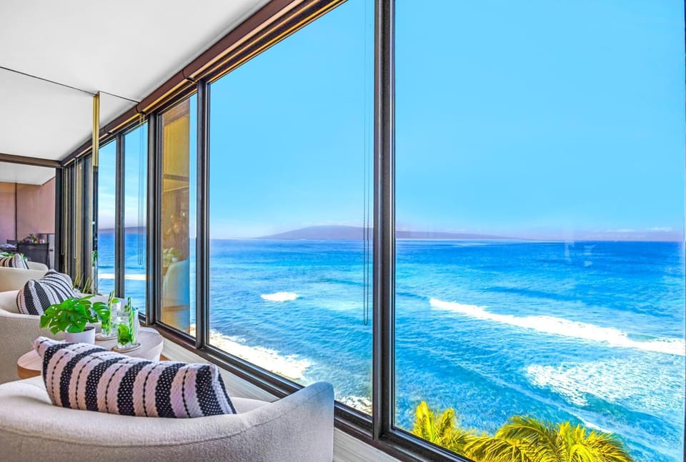 A cozy seating corner lets you sip your morning coffee and watch the waves, without ever leaving the living area.