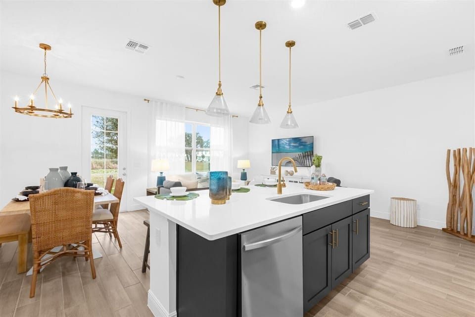 Spacious kitchen with island seating, perfect for family meals or morning coffee.