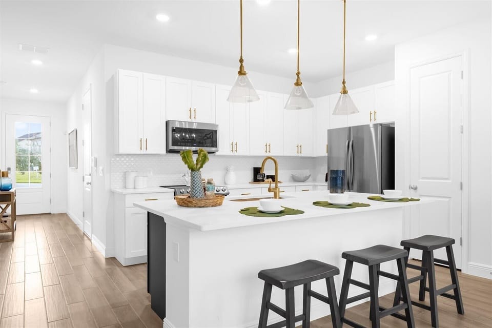 Another view of the kitchen and bar