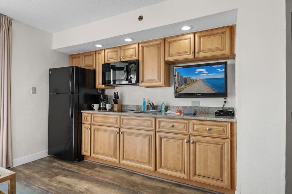 Smart Tv in the living room and kitchen area.  Perfect for streaming your favorite apps