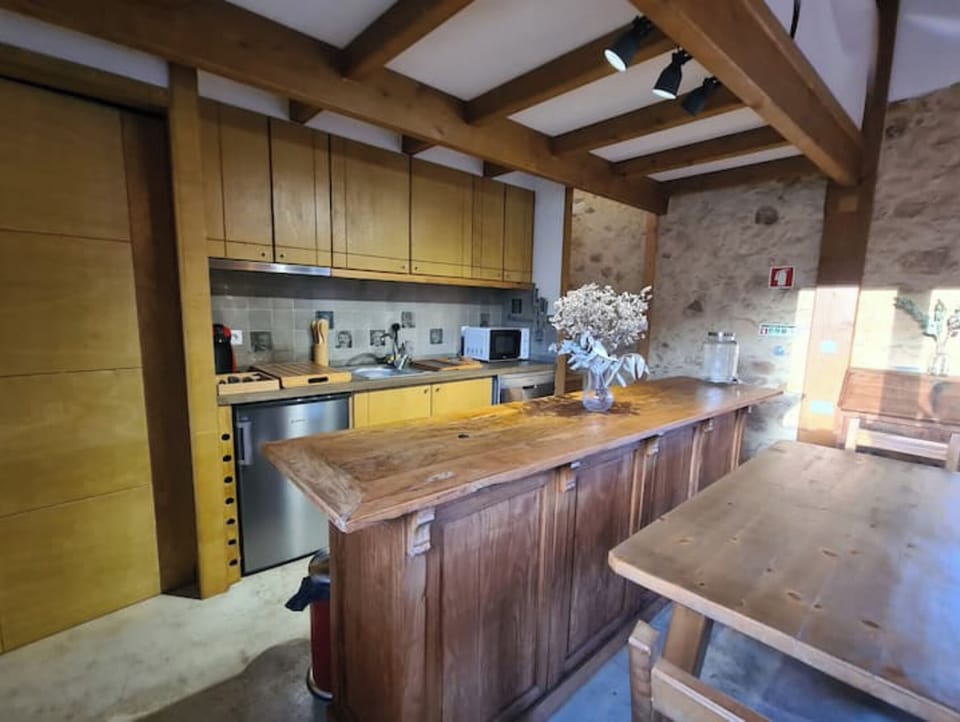 Kitchen with tiles of famous locals sporting popular moustaches of the era! 
