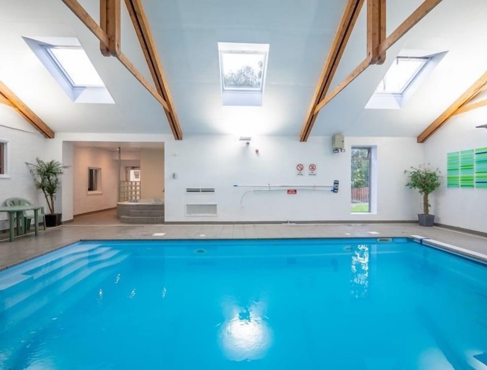 Indoor heated swimming pool with jacuzzi spa pool