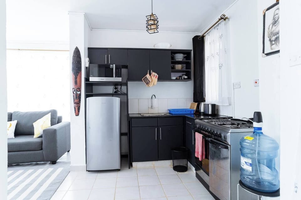 A view of a fully equipped kitchen, Guest can be able to prepare all kinds of meals, making the apartment great for long term guests