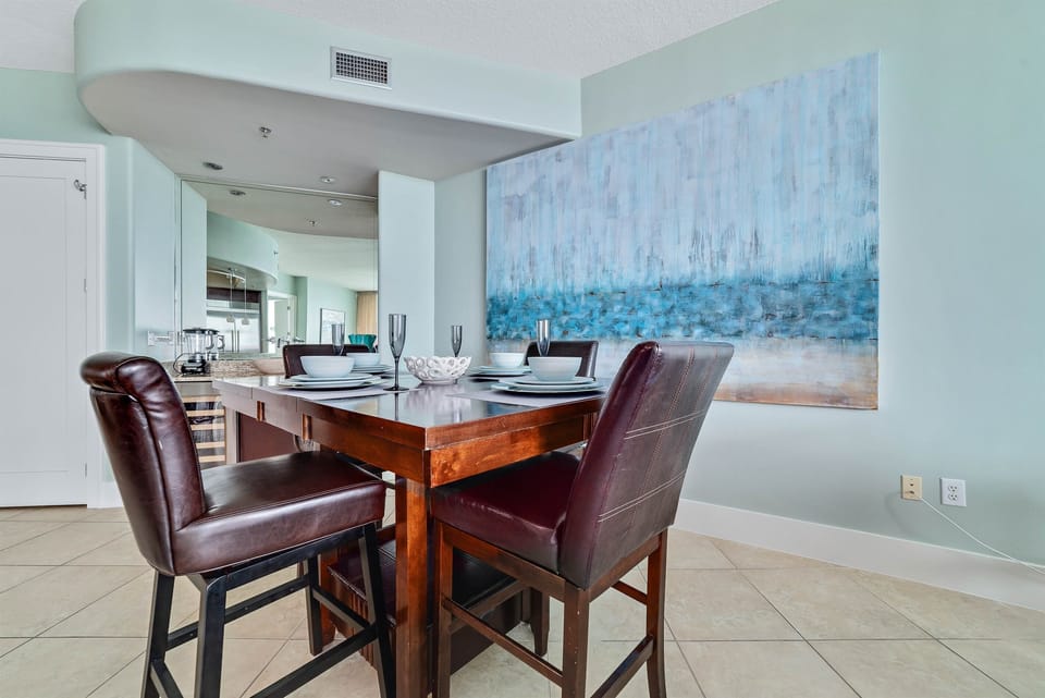 A welcoming dining space where culinary delights and conversation flow seamlessly. This area offers a perfect blend of comfort and style for memorable meals.