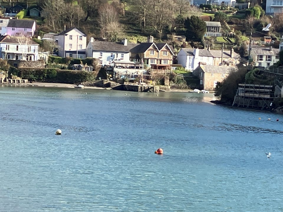 Looking across to The Swann Inn at Noss Mayo the other side of the river