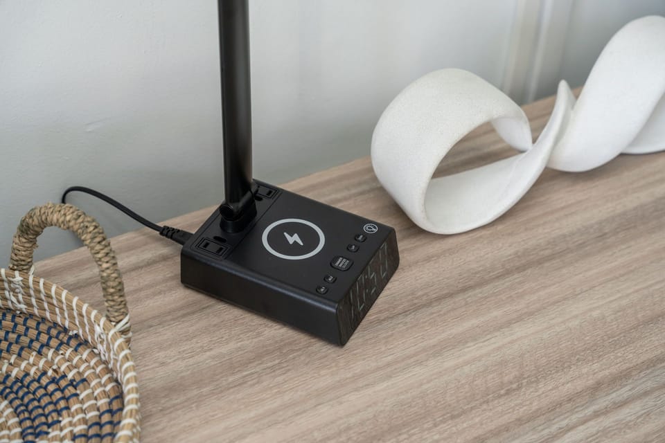 Reading lamp with alarm clock. 