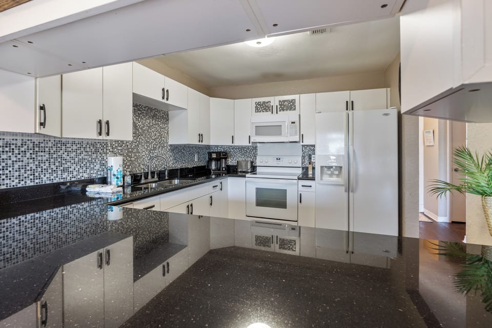 Kate's Place at 13554 Perdido Key Drive - Fresh modern kitchen with great countertops and tile work.
