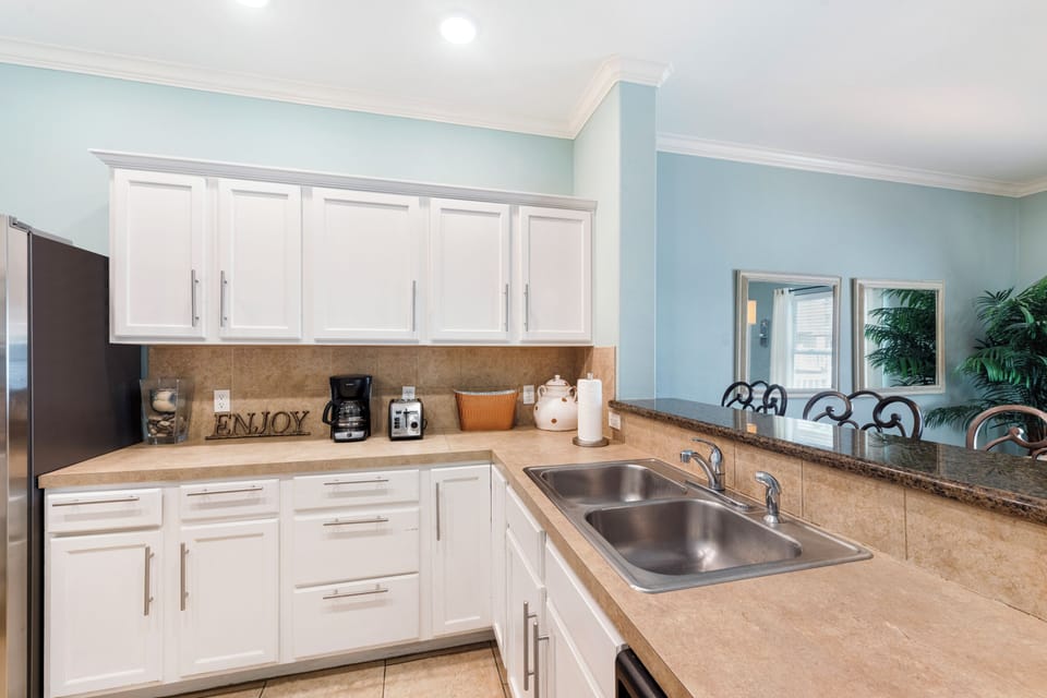Your fully equipped kitchen awaits with granite countertops, modern appliances, and everything you need to create delicious meals during your stay.