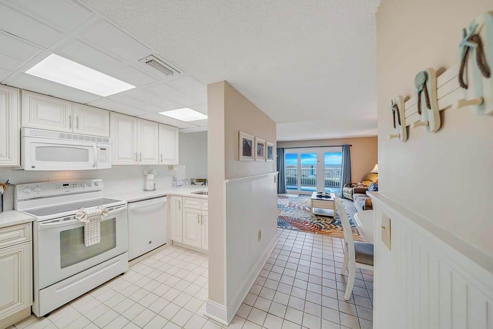 The fully equipped kitchen features quartz countertops and has everything you need to prepare meals for family & friends.