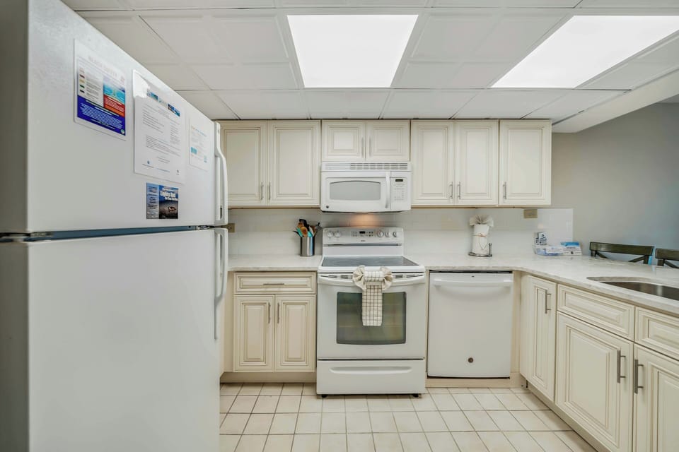 The fully equipped kitchen features quartz countertops and has everything you need to prepare meals for family & friends.