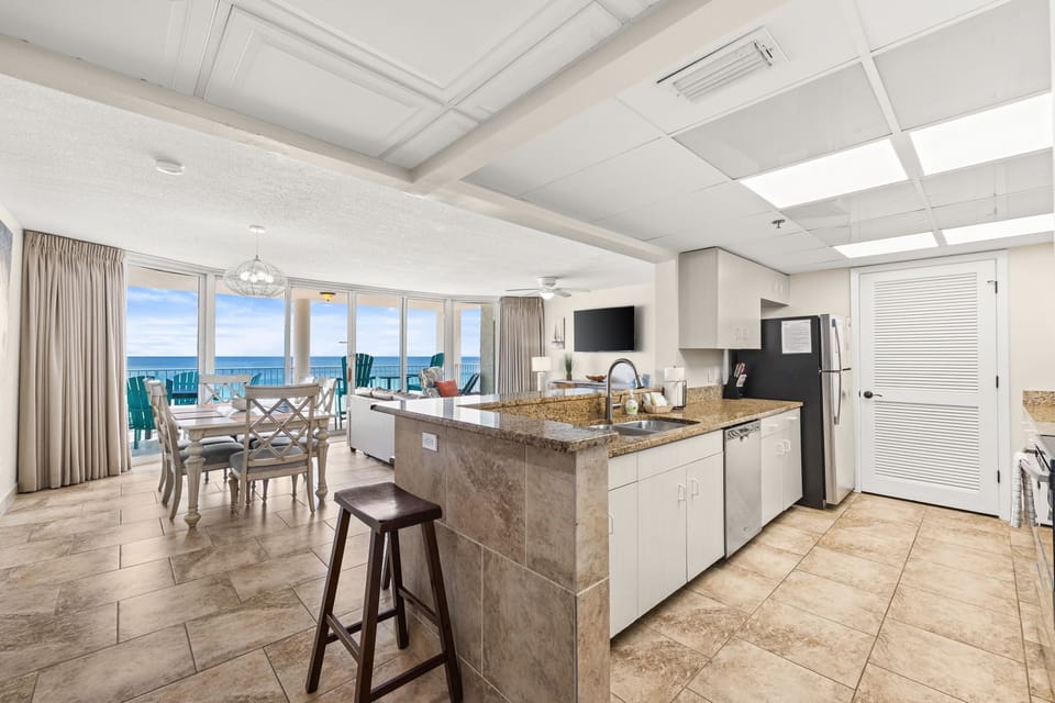 The fully equipped kitchen features granite countertops, stainless-steel appliances, and has everything you need to prepare meals for family & friends.