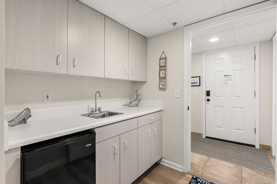 The third bedroom is essentially an efficiency unit with its own wet bar/kitchenette area.