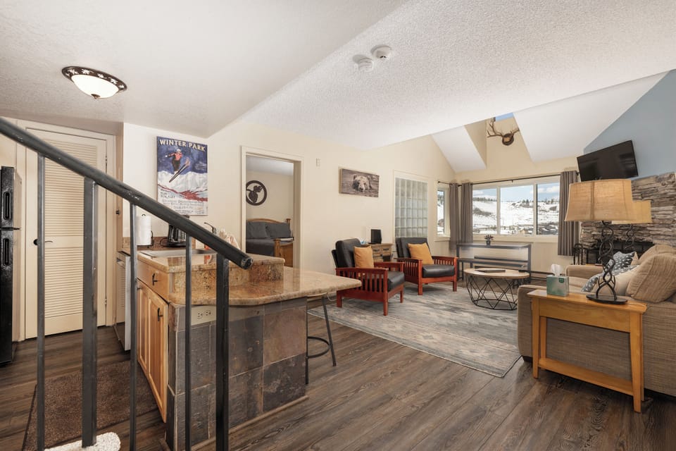 Relax in your spacious mountain retreat at Summit Unit 1303 with cozy living area, full kitchen, and fireplace perfect for après-ski evenings.