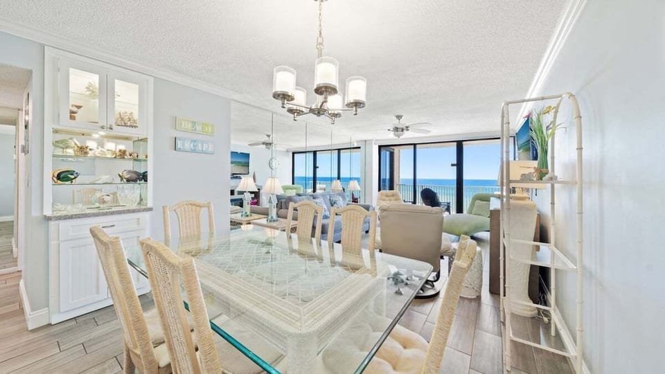 Dining room and living room with view of the balcony.