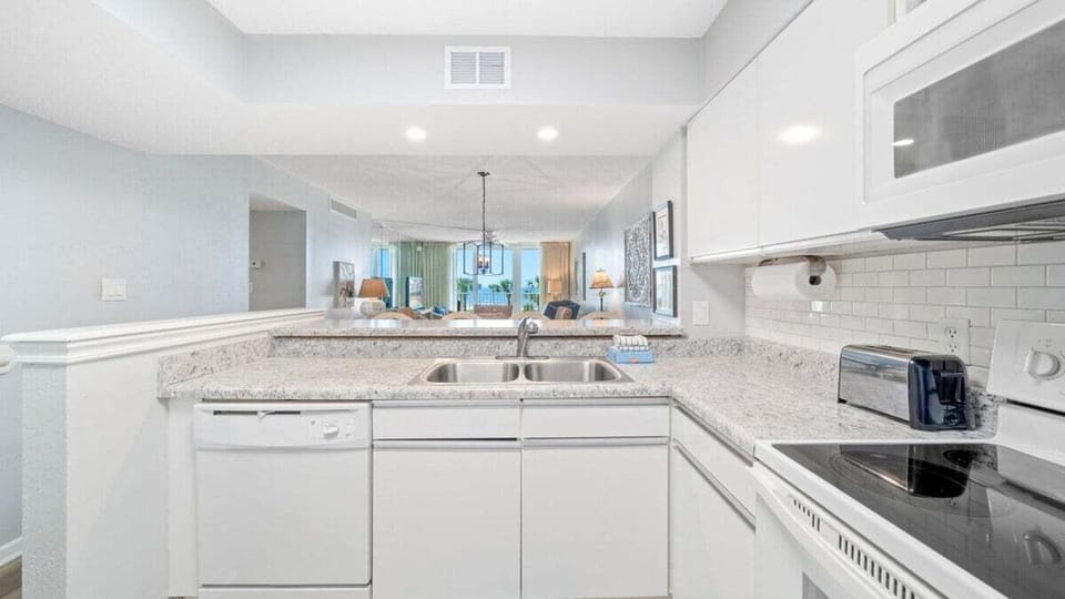 Bright, Fully Stocked Kitchen – Granite counters, full-size appliances, and an open layout make cooking easy and social.