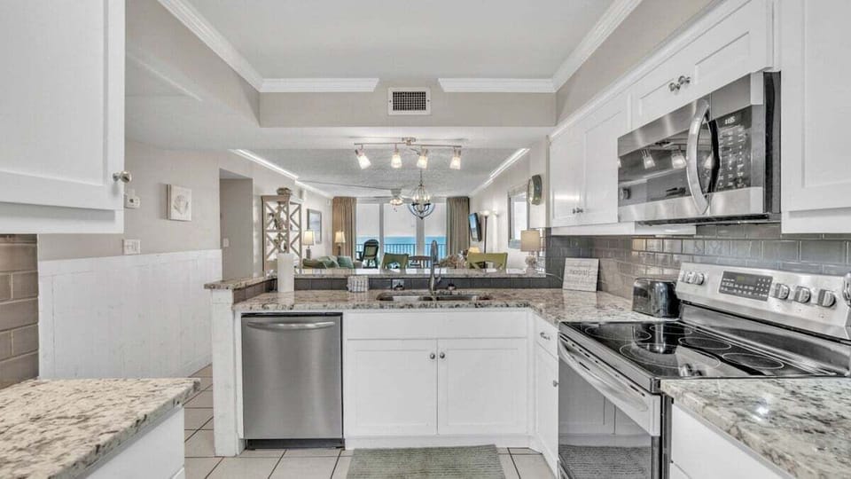 Open-concept kitchen connected to the dining room and living room