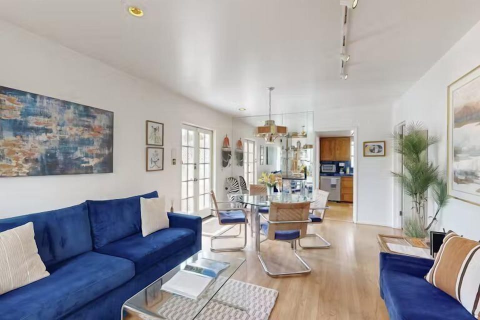 Kick back and relax in the living room with a cozy, inviting blue sofa