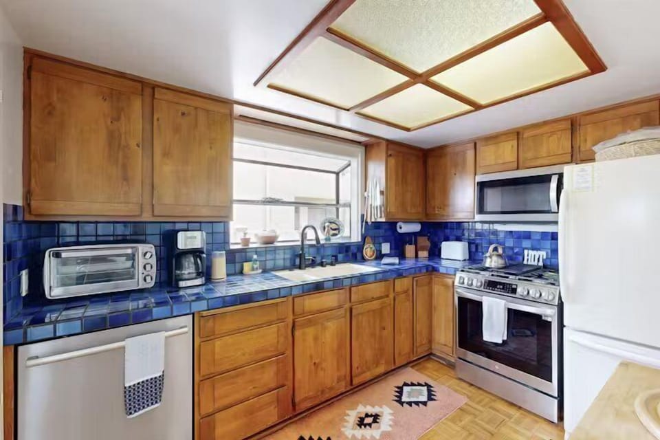 Whip up your favorite meals in a kitchen fully stocked with cooking essentials and modern appliances.
